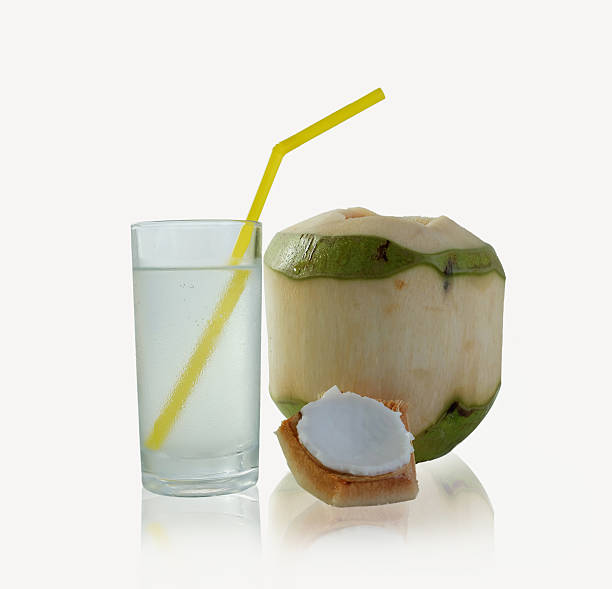 istock drinking coconut water in a glass 498883600