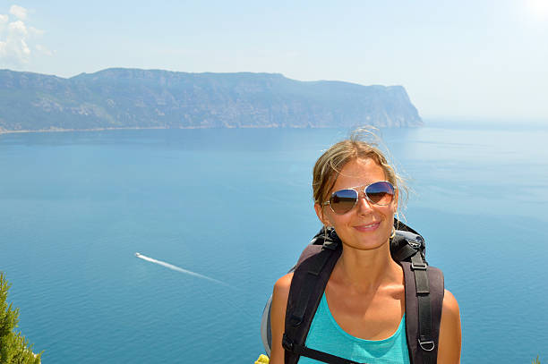 Tourist girl on a coast of Black sea, Crimea stock photo