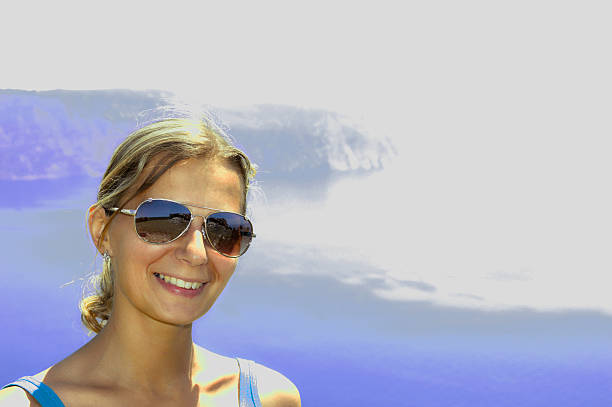 Beautiful young girl and sea view stock photo