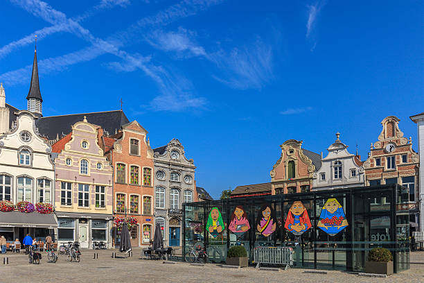Mechlin, Belgium - September 15, 2014: Tourists and local people in the Grote Markt, the main square of Mechlin. The square and the streets of the old town are bordered by beautiful ancient buildings.