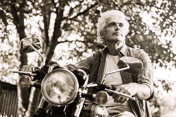 istock Confident man riding a motorbike 498887010