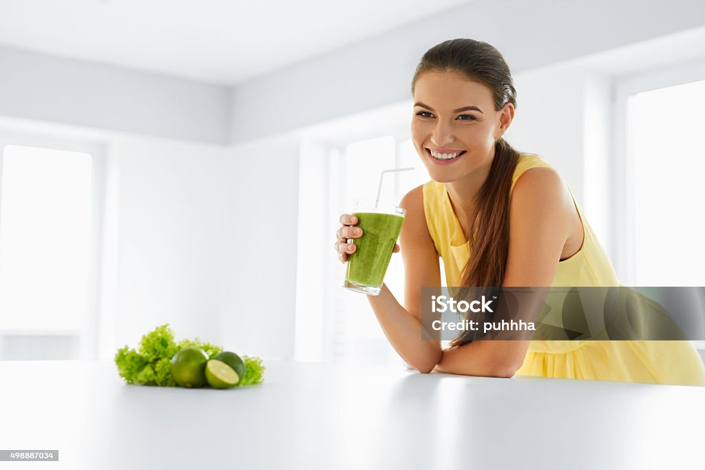 Healthy Meal. Woman Drinking Detox Smoothie. Lifestyle, Food. Drink Healthy Meal. Happy Beautiful Smiling Woman Drinking Green Detox Vegetable Smoothie. Healthy Lifestyle, Food And Eating. Drink Juice. Diet, Health And Beauty Concept. Beautiful Woman Stock Photo