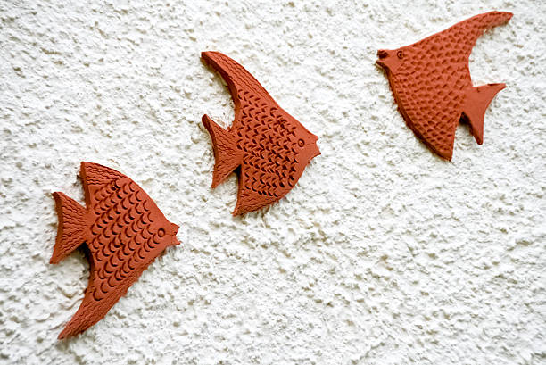 Ceramic Brown Tropical Fishes for Decoration on White Textured Wall