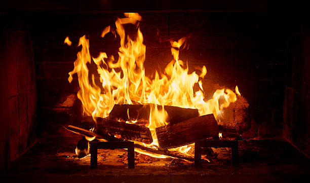 Fireplace Burning fireplace. fireplace stock pictures, royalty-free photos & images