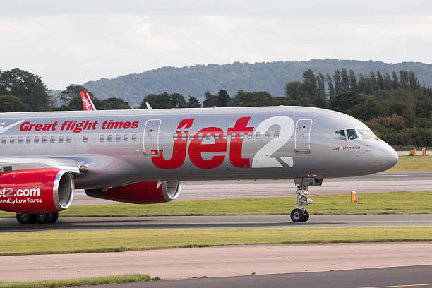 Jet2 Boeing 757 Manchester, United Kingdom - August 27, 2015: Jet2 Boeing 757 narrow-body passenger plane "Jet2Menorca" taxiing on Manchester International Airport taxiway. boeing 757 stock pictures, royalty-free photos & images