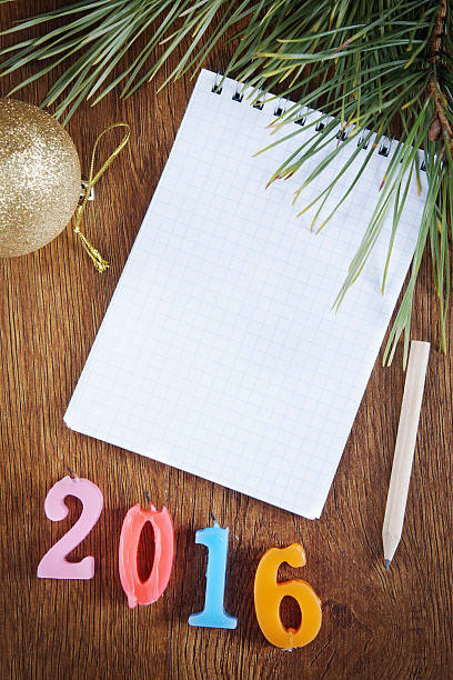 istock Wooden festive background with blank notepad about Happy New Yea 498894382
