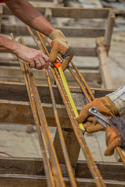 istock Measuring and marking steel rods for making beam cages 498901707