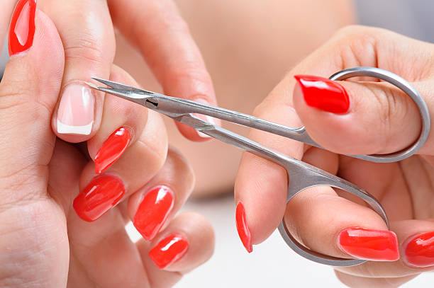 istock manicure applying - cutting the cuticle 498903125