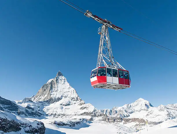 A cable car at the ski resort of Zermatt in Switzerland, with the peak of the Matterhorn in the background.