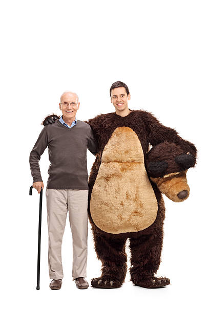 istock Senior posing with a guy in a bear costume 498907284