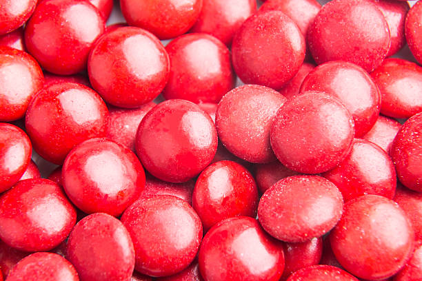 istock Close up on pile red milk chocolate candies crisp shell 498909800