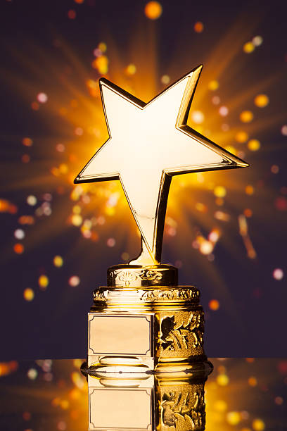 istock gold star trophy against shiny background 498910642
