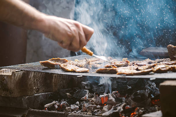 istock Grilling pork meat chops on barbecue 498910710