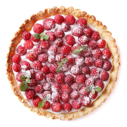 Tart with fresh raspberries and mint close-up isolated on white background