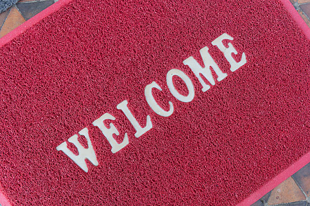 istock The new doormat of welcome text 498911860