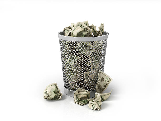 Money in basket. Isolated over white stock photo