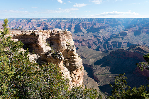 Grand Canyon, Arizona, USA - May 26, 2015: A group of tourists enjoy the view over the Grand Canyon National Park from Mather Point during a hot summer day.