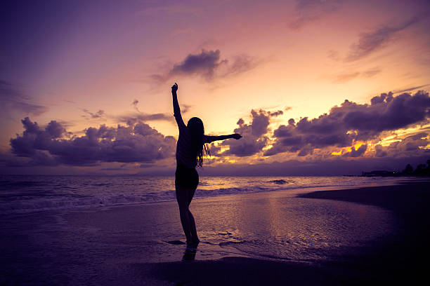 istock Silhouette of Woman at beach 498915034