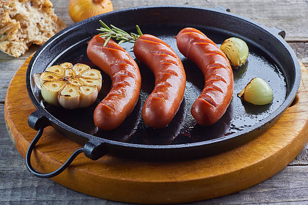 istock Grilled sausages with garlic and onion 498918006