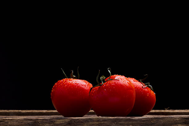 istock Red Tomato in spray of water. 498919950