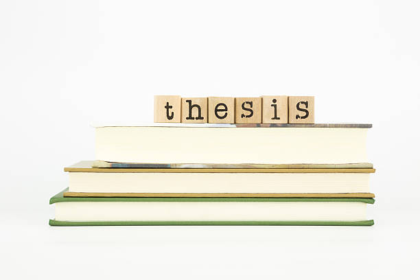istock Thesis word on wood stamps and books 498924365