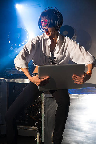 istock Girl composes music in the studio at the computer 498924649