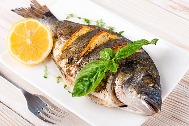 istock Dorado fish with lemon and spices 498924753