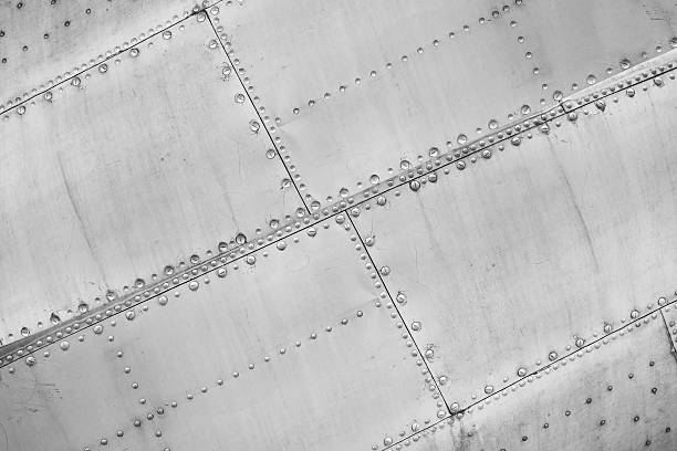 Aircraft construction. Plane - Constructional close up riveted metal texture stock pictures, royalty-free photos & images