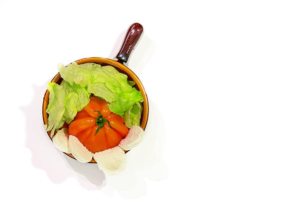Dish with a tomato, salad and mozzarella
