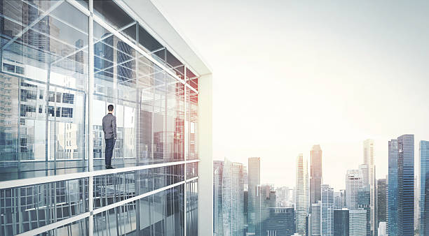 istock Businessman looking at city through window 498928793