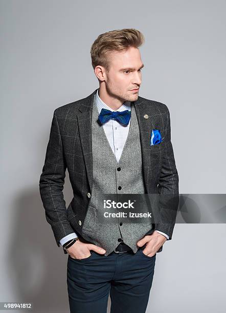 Fashionable Young Businessman Wearing Tweed Suit And Bow Tie Stock Photo - Download Image Now