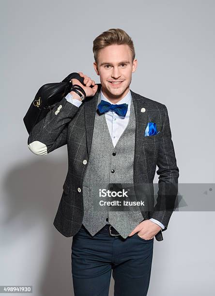 Charming Young Businessman Wearing Tweed Jacket And Bow Tie Stock Photo - Download Image Now
