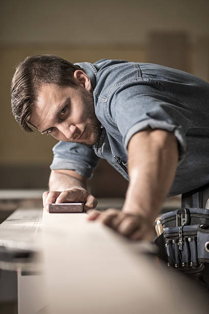 istock Joiner polishing wooden board 498942658