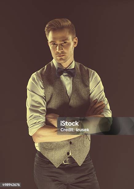 Handsome Elegant Man Wearing Bow Tie And Tweed Vest Stock Photo - Download Image Now