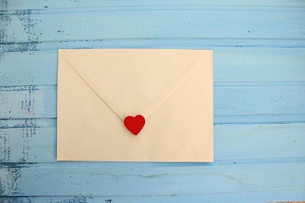 istock White love letter on blue background 498944478