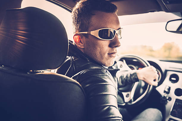 istock Portrait of a Young Man and his Car 498944936