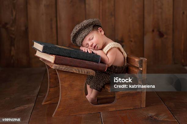 Newborn Baby Boy Sleeping At His School Desk Stock Photo - Download Image Now - Babies Only, Baby - Human Age, Baby Clothing