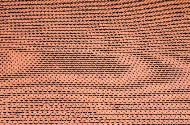 istock Red tiles roof background 498947348