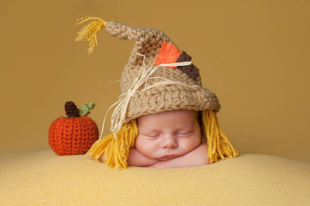 Newborn Baby Boy Wearing a Scarecrow Hat stock photo
