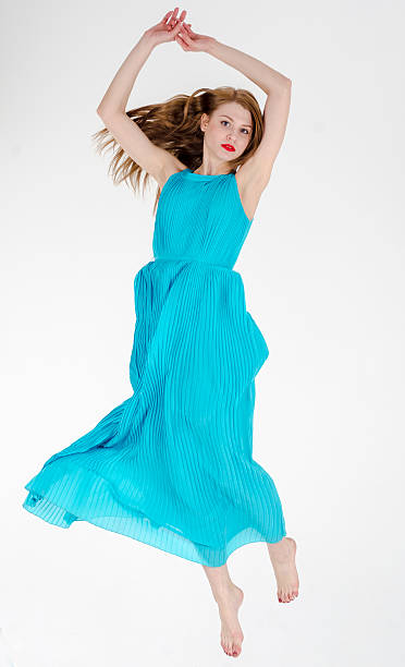 istock slender girl dancing in dress 498948228