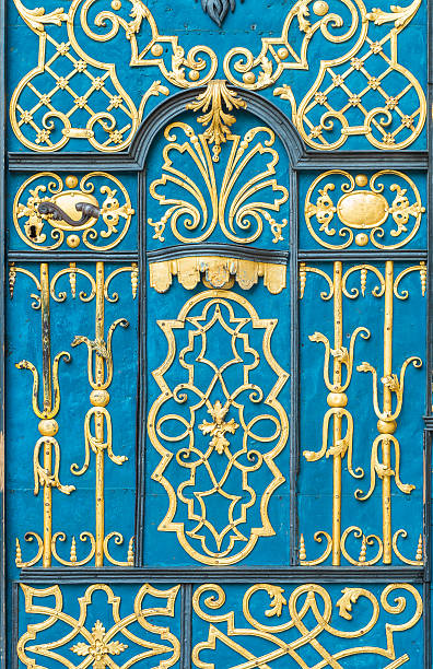 istock Blue door decorated with golden adornment 498948402