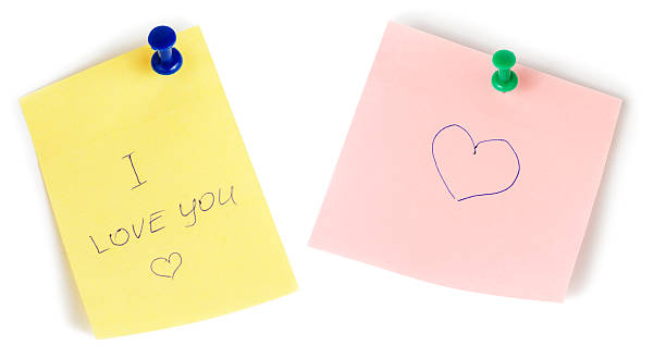 istock Yellow and pink note papers with push and heart isolated 498948554