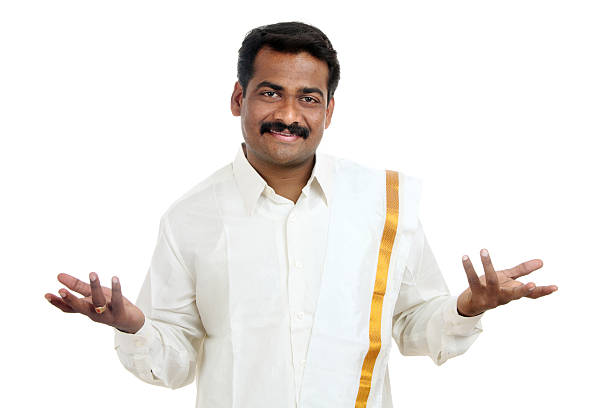 Happy Indian traditional young man giving gesture isolated on white.