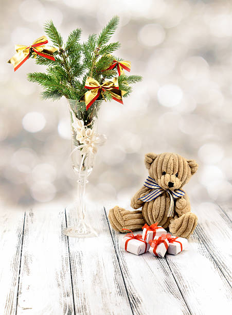 istock Christmas tree in white decorative goblet, toy bear and snow 498950510