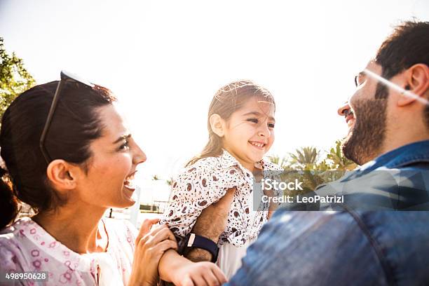 Happy Family Outdoor In A City Park Stock Photo - Download Image Now - Family, Arabic Style, Middle Eastern Ethnicity