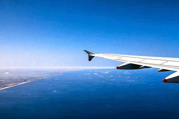 Big passenger jet airplane gaining altitude after taking off from the Ben Gurion International Airport with soft focus. Tel Aviv. Israel