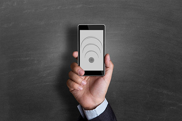 istock Businessman hand showing smart phone 498951350