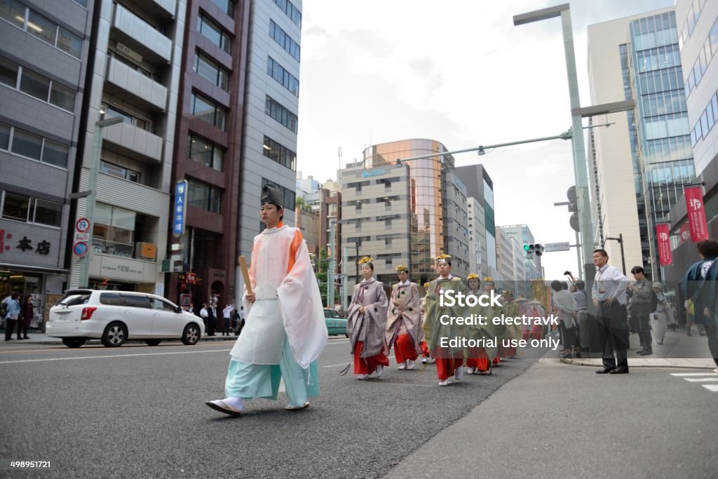 Japanese festival Tokyo, Japan - June 13, 2014: Shinto priests and priestesses in traditional clothing taking part in the Hie Shrine Tenka Matsuri  in central Tokyo. Asia Stock Photo