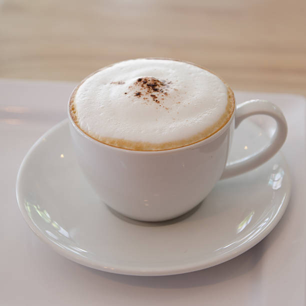 istock Cappuccino coffee cup with sugar, biscuit  and drinking water 498951829
