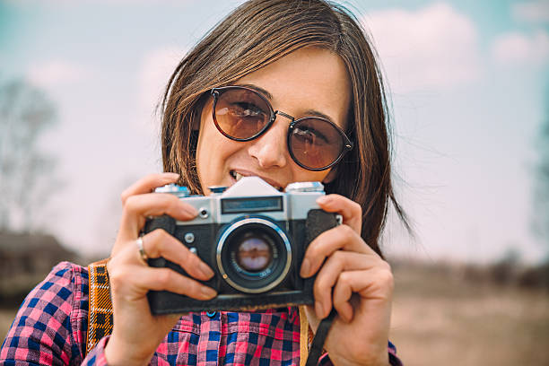 istock Hipster girl with photo camera 498952367